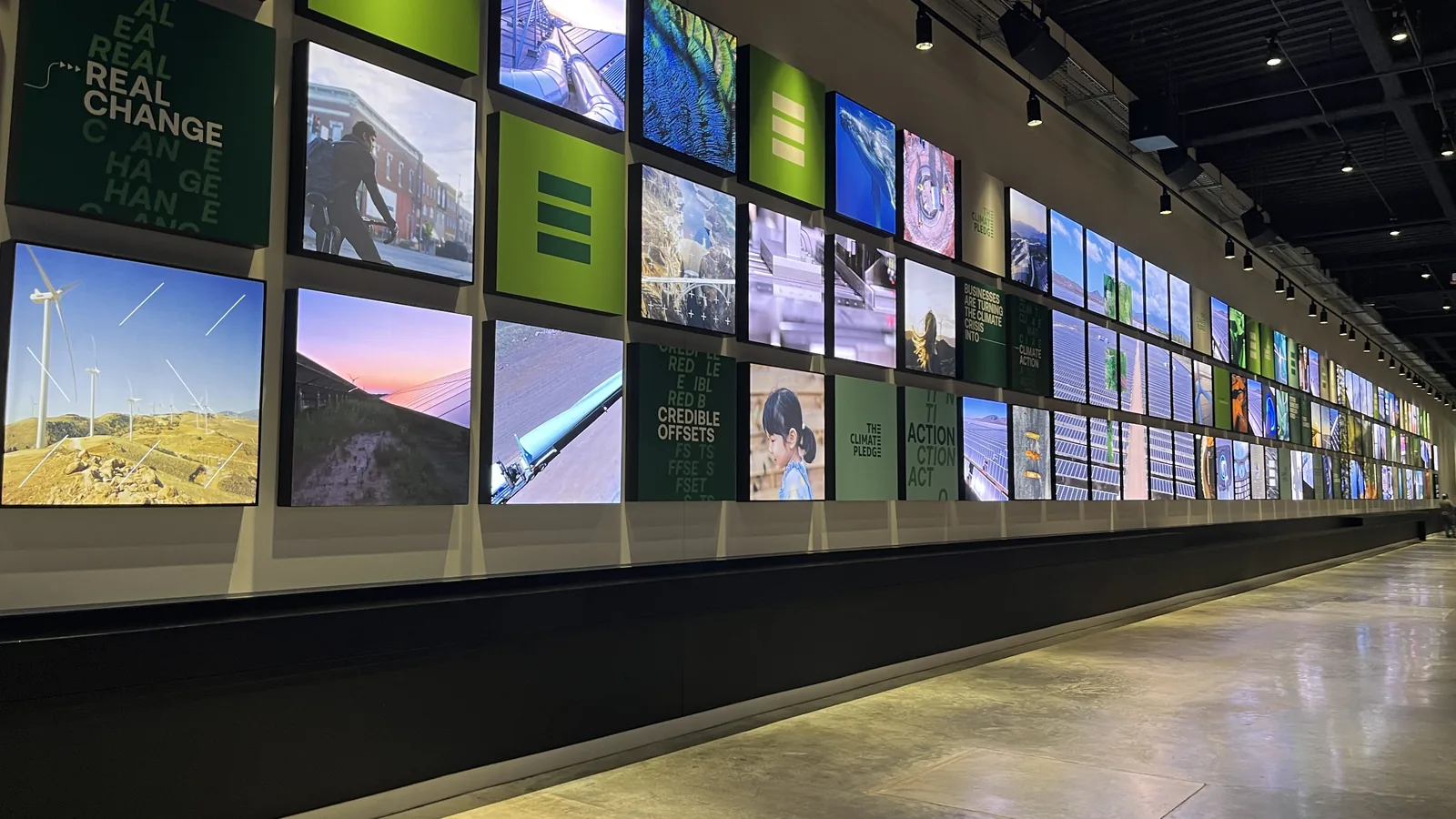 Climate-themed digital display wall inside Climate Pledge Arena